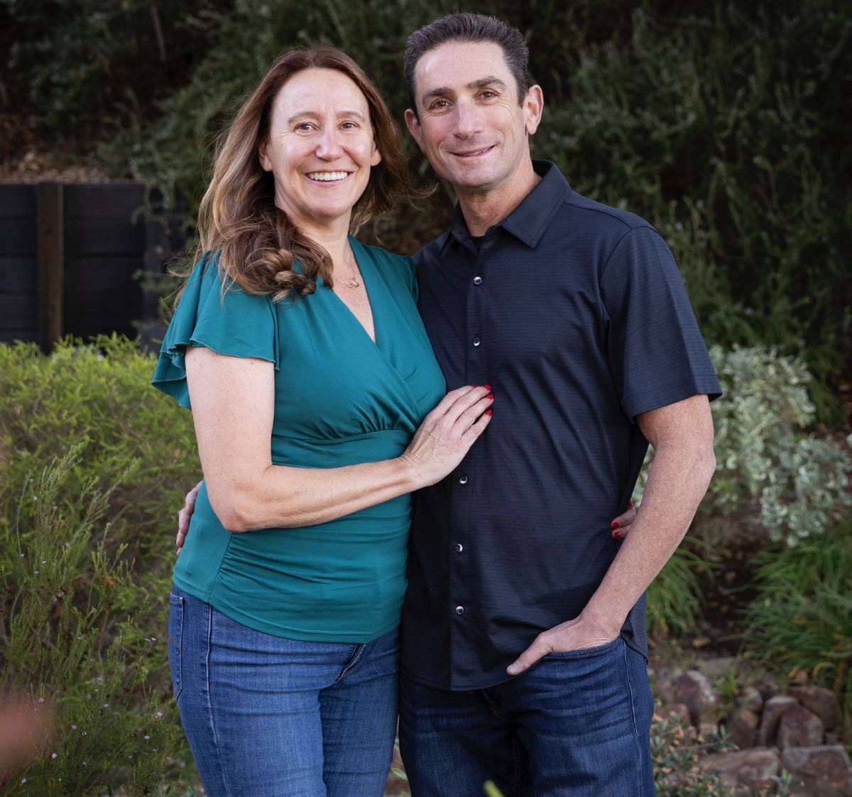 marc_sandee man holding hand of woman standing near tree